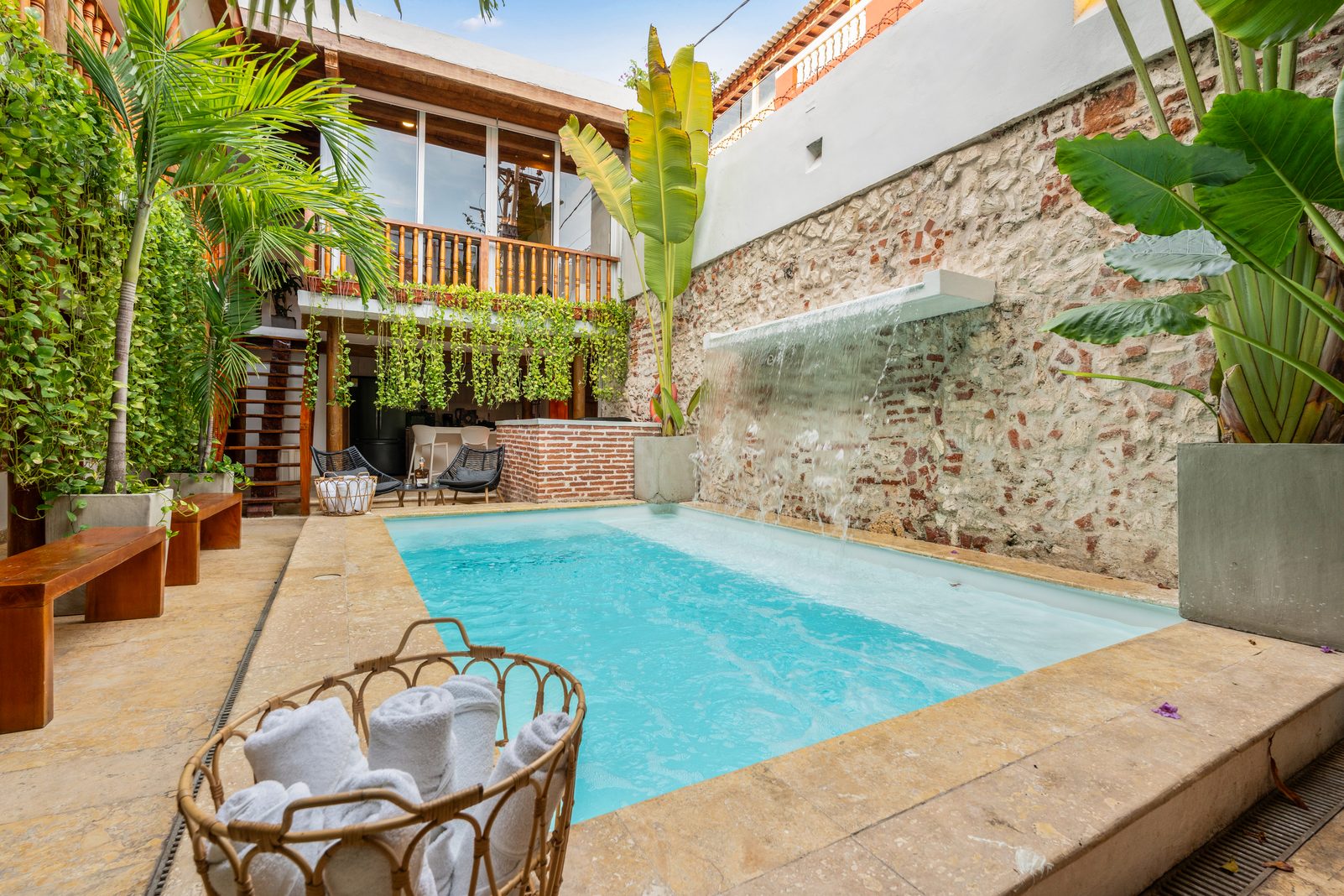 Casa Oasis, a villa in Getsemani, Cartagena, with a tropical courtyard and cascading-waterfall pool